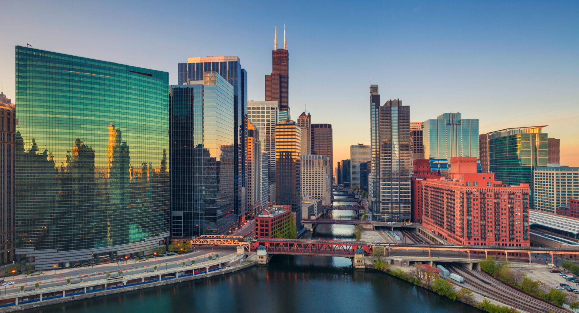 Chicago at dawn. Cityscape image of Chicago downtown at sunrise. Chicago at dawn. Cityscape image of Chicago downtown at sunrise.